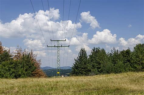 Electricity Transmission Lines Under Serene Blue Sky And Clouds Photo Background And Picture For ...