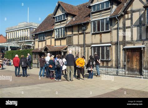 Tourists Being Given A Guided Tour Of William Shakespeares Birthplace