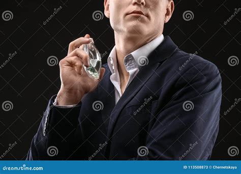 Handsome Man In Suit Using Perfume Stock Image Image Of Atomizer