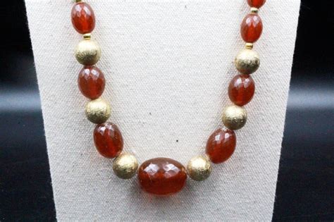 Vintage Cherry Amber Bakelite Pressed Gold Tone Bead Gem