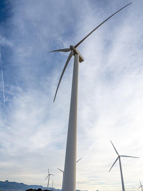 Premium Photo Wind Turbines At Dawn Blue Sky With Clouds Wind Farm