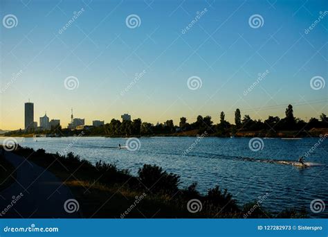 Wakesurfing on Danube River with Sunset Background and View on Vienna ...