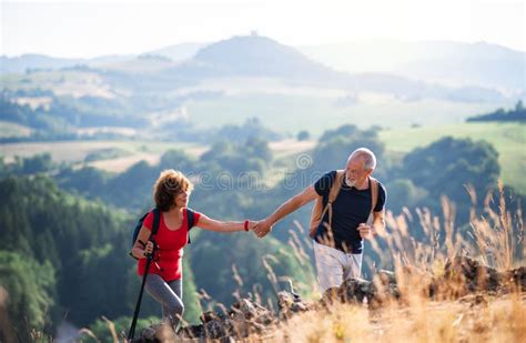 Two Senior People Hiking In Nature Stock Image Image Of Seniors