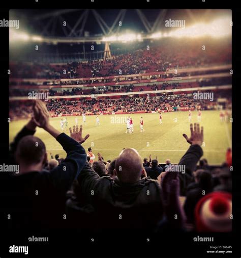 Fans at the Emirates stadium Stock Photo - Alamy