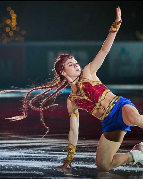 A Woman Is Performing On The Ice