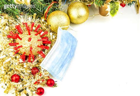 Golden Coronavirus Mask And Christmas Baubles Isolated On White