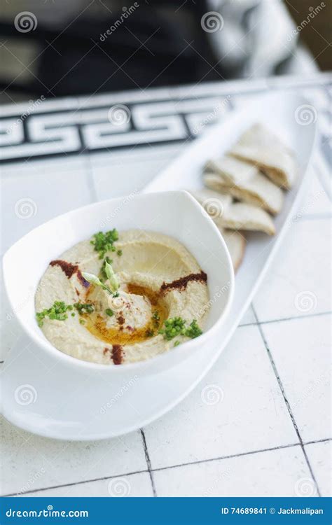 Hummus Or Houmous Appetizer Made Of Mashed Chickpeas Tahini Lemon