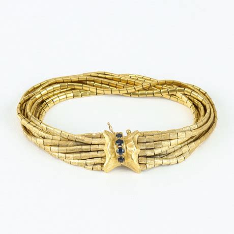 ARMBAND 18 k guld med 4 st safirblå stenar Italien 1950 60 tal Smycken