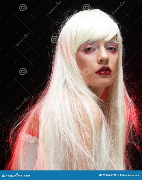 Beautiful Young Woman with Long White Hair Over Dark Background with