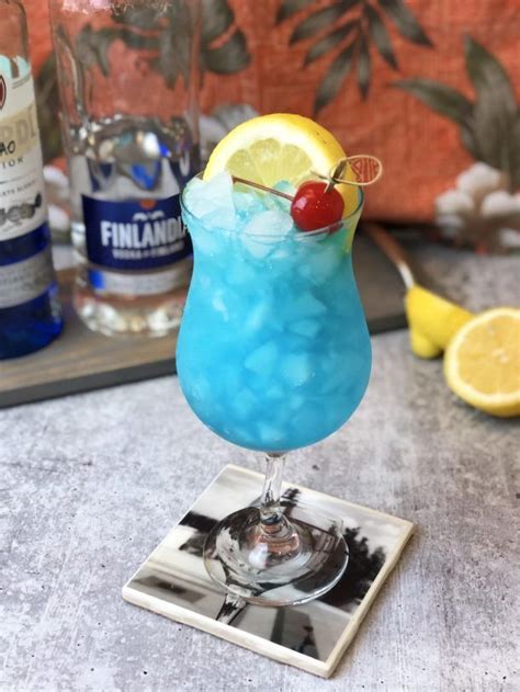 A Blue Cocktail Sitting On Top Of A Table