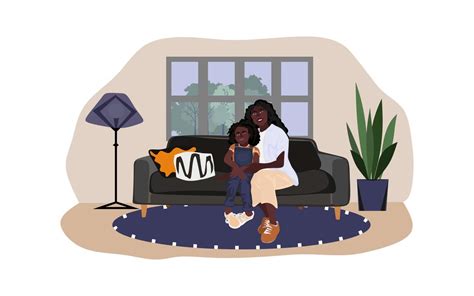 African American Mother With Daughter Sitting On The Sofa In The Room