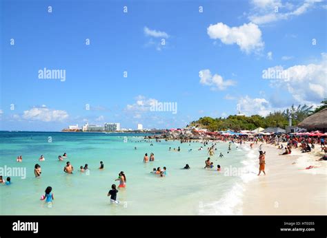 local people on beach cancun mexico Stock Photo - Alamy