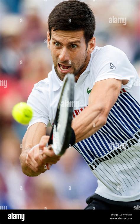 Novak djokovic two handed backhand hi-res stock photography and images ...