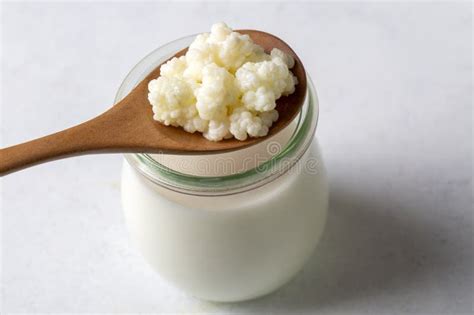 Kefir Fermented Milk Drink with Kefir Grains. Homemade Kefir Stands in ...