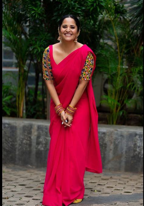 Anasuya Bharadwaj In A Plain Saree With A Mirror Work Blouse