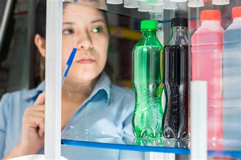 Detailed View Of Sugary Soft Drinks In A Glass Display Case While A ...