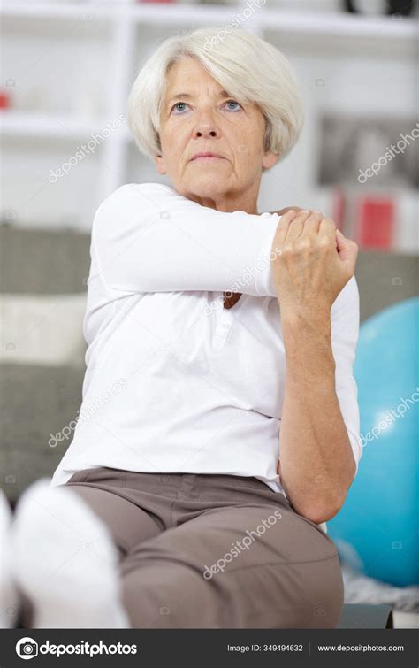 Mature Woman Exercising Home — Stock Photo © Photography33 349494632