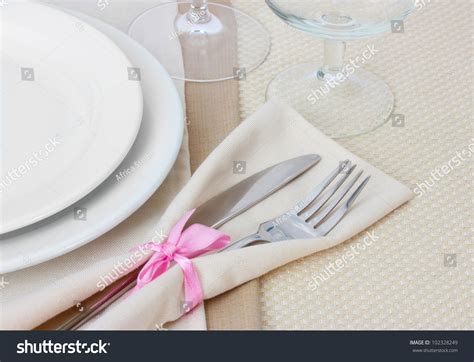 Table Setting With Fork Knife Plates And Napkin Stock Photo