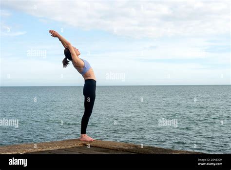 Yoga Poses Woman Standing In Backbend Asana Practicing In Anuvittasana