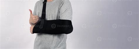 Broken arm. Arm Sling therapy support and covered around elbow first ...