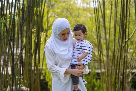 Premium Photo Mother With Son Standing Outdoors