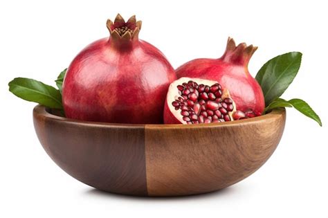 Premium Photo Pomegranates In A Wooden Bowl