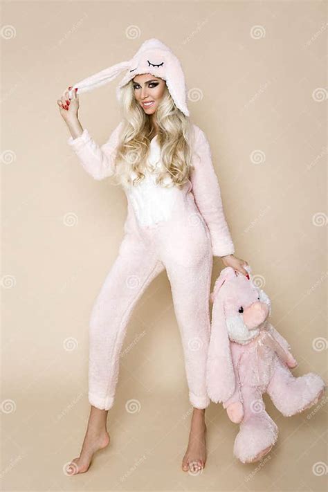 Beautiful Blonde Woman Wearing A Pajama A Bunny Costume Smiling