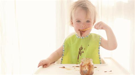 Baby Getting Messy Eating Chocolate Pudding, Stock Footage | VideoHive