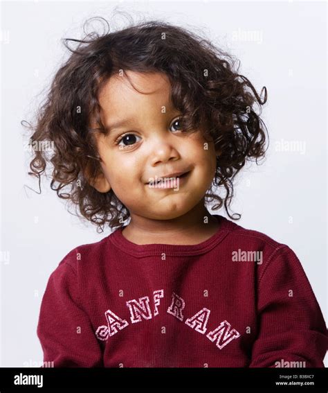 Mixed Race boy with curly hair Stock Photo - Alamy