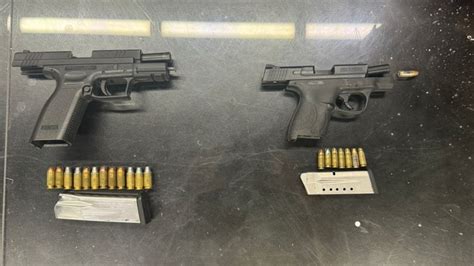 Two Men Arrested For Handgun Possession