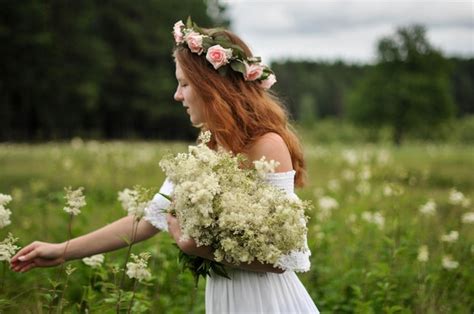 Premium Photo | Girl picking flowers