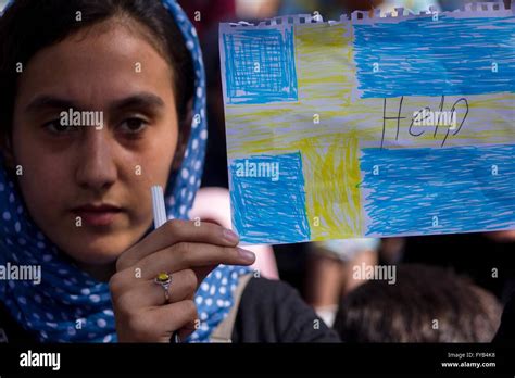 Afghan Refugees At Habour Of Piraeus Afghan Woman With Swedish Flag