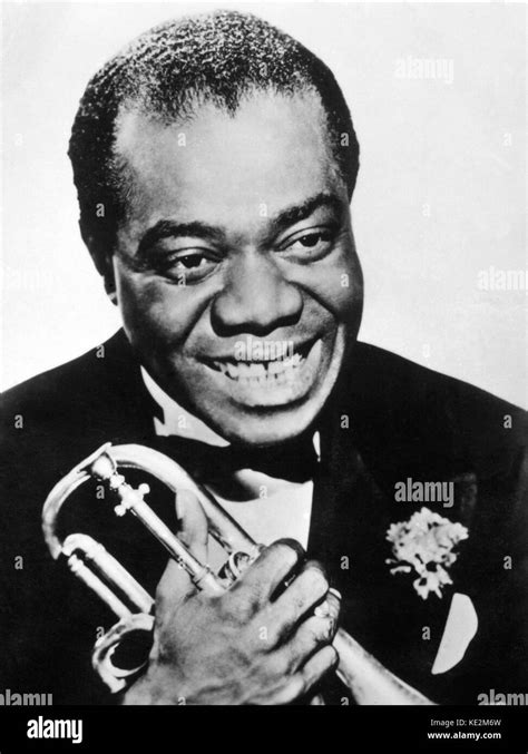 Louis Armstrong - portrait of the American jazz musician holding a ...