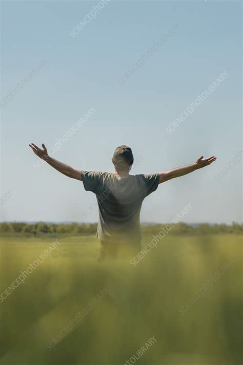 man raising hands  field stock image  science photo