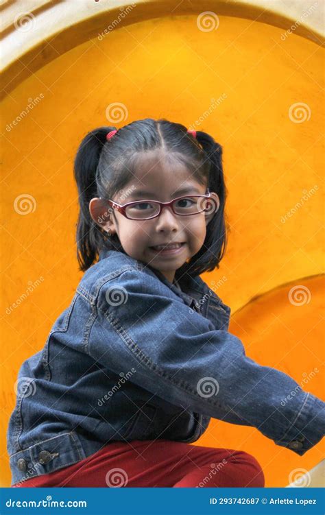 4 Year Old Latina Brunette Girl Plays In The Playground As Therapy For Attention Deficit