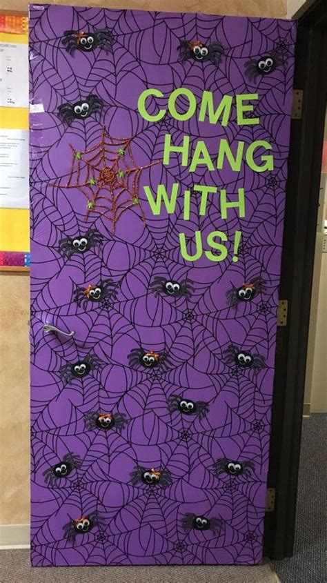 A Purple Door Decorated With Halloween Decorations And Writing That