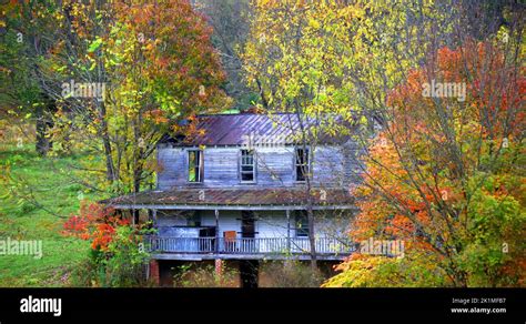 Empty Windows Boarded Up Door Rail Porch And Tin Roof Complete This