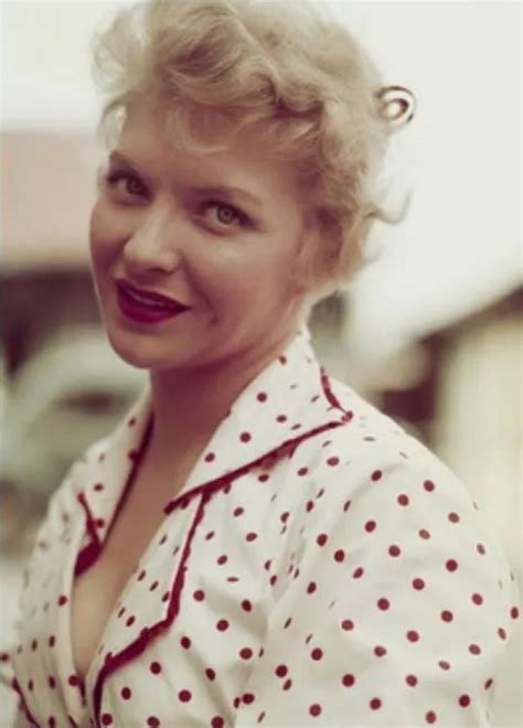 An Old Photo Of A Woman With Red Lipstick And Polka Dots On Her Shirt