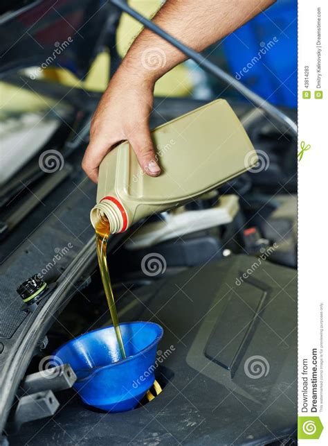 Car Mechanic Pouring Oil Into Motor Engine Stock Image Image Of