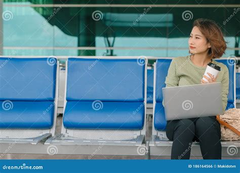 Coffee Time Attractive Woman Sitting In Airport Lounge Drinking