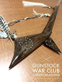 Black walnut Native American gunstock war club. Horse hair feathers and ...