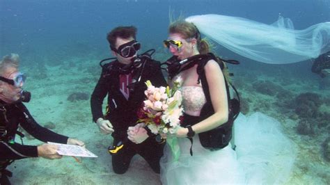 In Sea Sickness And In Health Couple Stage Underwater Wedding