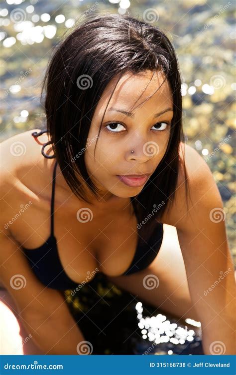 Slim African American Woman Outdoors In Black Bikini Stock Photo