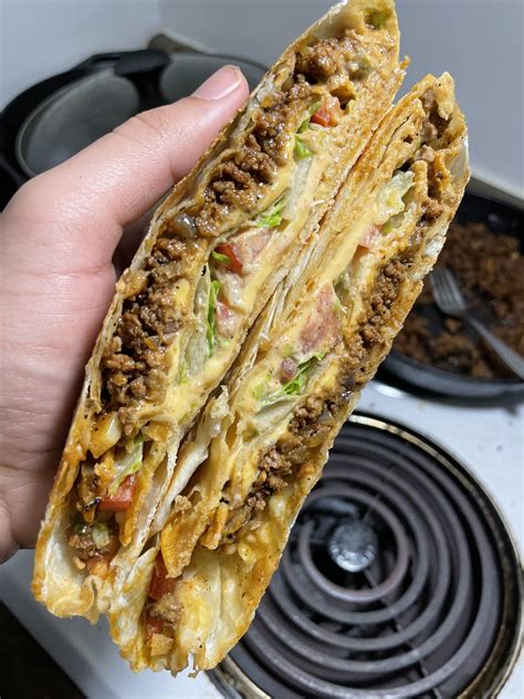 [homemade] Beef Crunch Wrap Supreme Lettuce Tomato Cheese And Jalapeño Sauce R Food