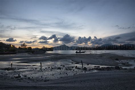 Sunset Scene Of The Fishing Boats Harbored At The Seaside Stock Image