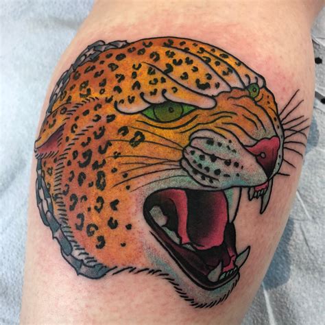 Traditional Leopard Head Tattoo