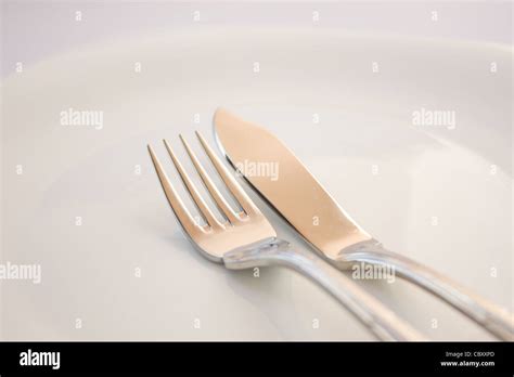 Fork and fish knife Stock Photo - Alamy