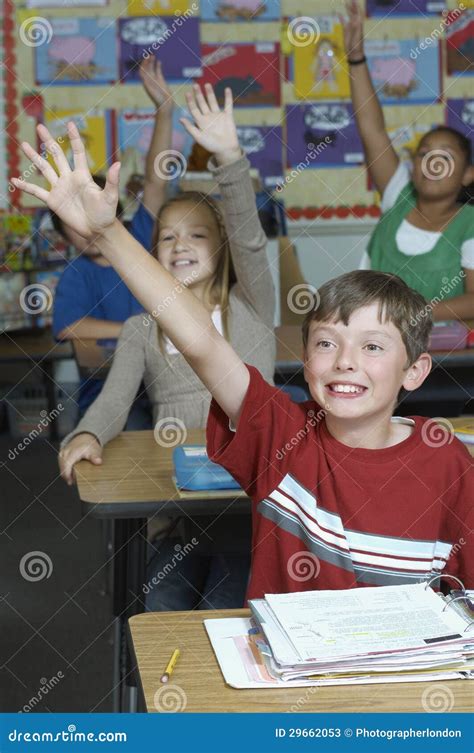 Students Raising Hands in Classroom Stock Image - Image of class, file ...