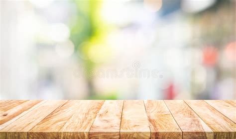 Empty Wood Table Top On Blur Abstract Window Glass View Stock Photo