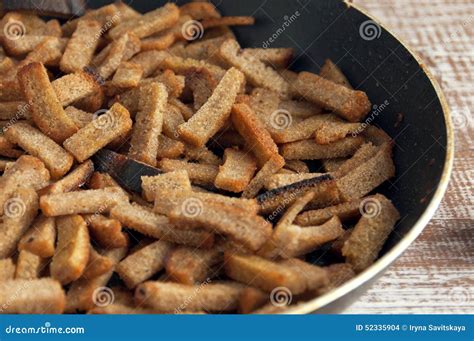 The Grain Croutons Fried In A Frying Pan Snack To Beer Stock Photo